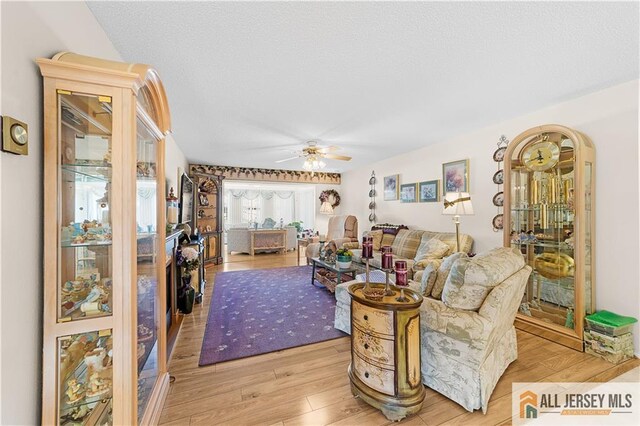 180 Mimosa Plz Unit 180A, Monroe, NJ 08831 - living area featuring light wood-style floors and a ceiling fan