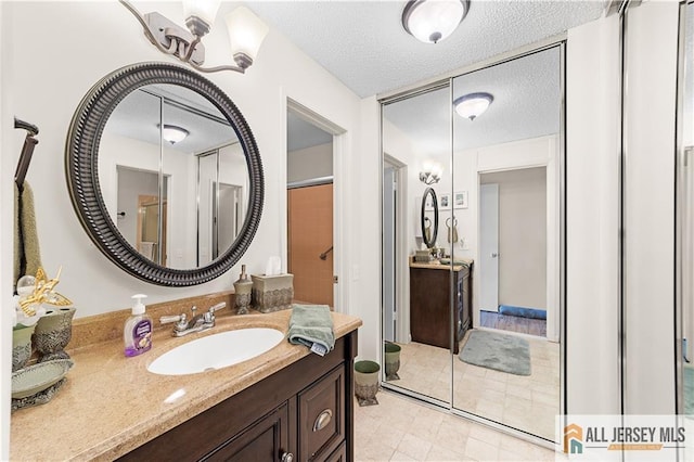 180 Mimosa Plz Unit 180A, Monroe, NJ 08831 - full bath with vanity and a textured ceiling