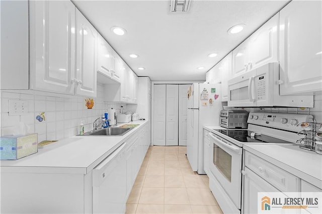 180 Mimosa Plz Unit 180A, Monroe, NJ 08831 - kitchen with white appliances, a sink, light tile patterned flooring, white cabinets, and light countertops