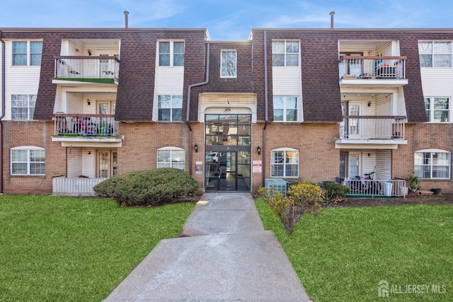 view of property featuring central AC unit