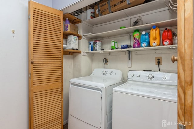 clothes washing area with independent washer and dryer and laundry area