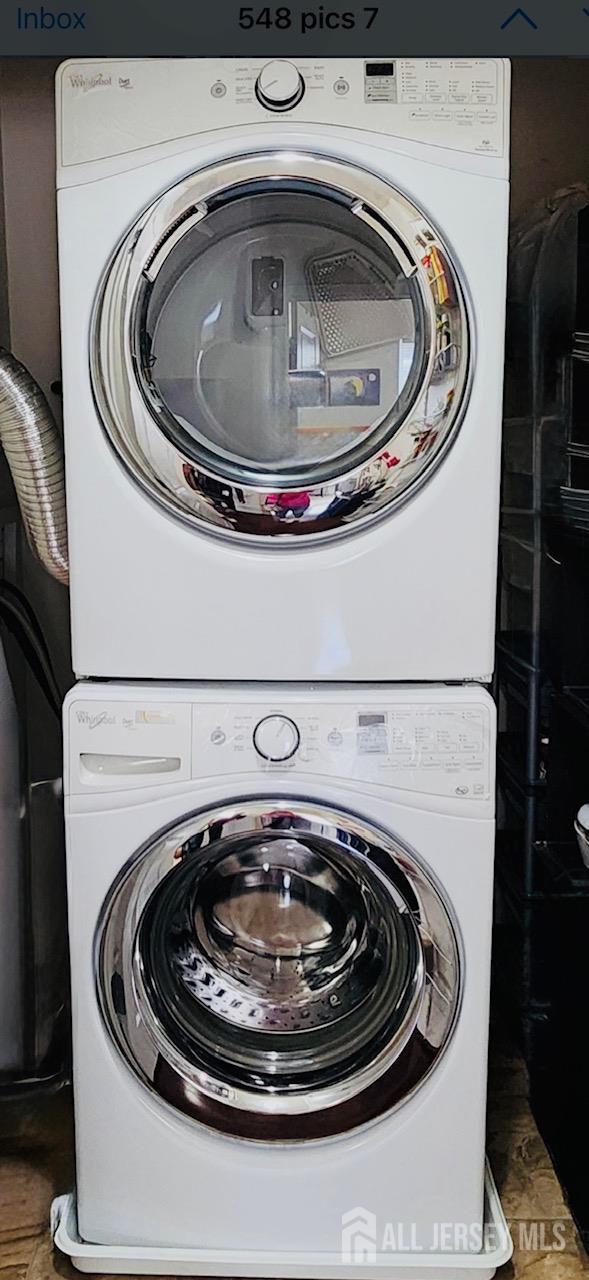 548 E Celebration Way E, South Plainfield, NJ 07080 - laundry room featuring stacked washing machine and dryer