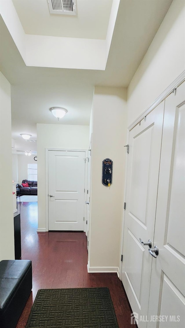 548 E Celebration Way E, South Plainfield, NJ 07080 - corridor with wood finished floors and a tray ceiling