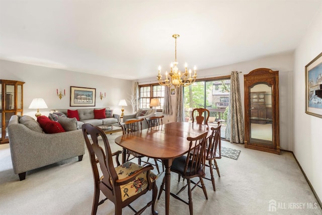 77 Highview Dr, Woodbridge Proper, NJ 07095 - dining room featuring light carpet and a chandelier
