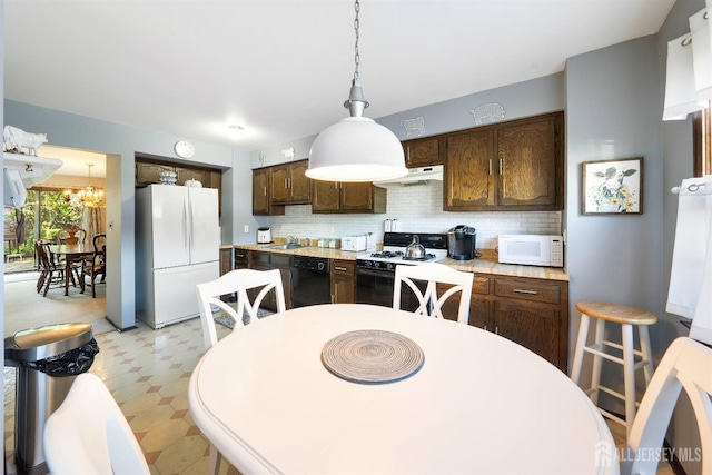 77 Highview Dr, Woodbridge Proper, NJ 07095 - kitchen featuring white appliances, a sink, dark brown cabinets, light floors, and decorative backsplash