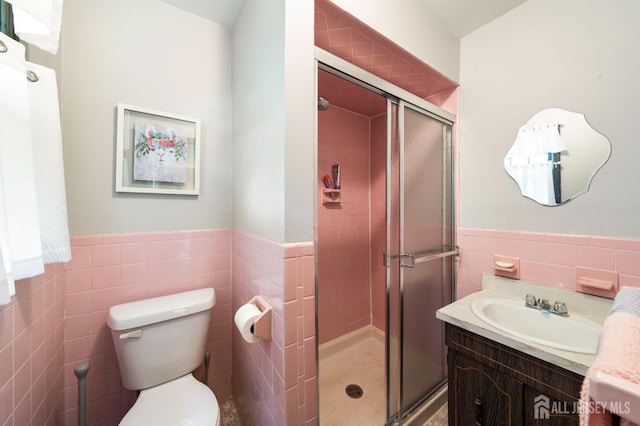 77 Highview Dr, Woodbridge Proper, NJ 07095 - bathroom with tile walls, vanity, a stall shower, toilet, and wainscoting