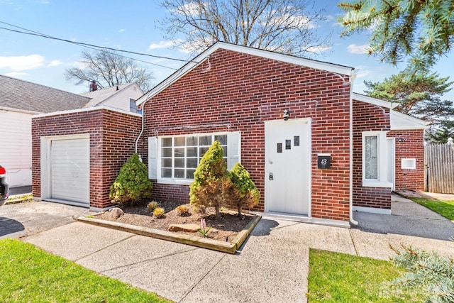 43 Jensen Ave, Fords, NJ 08863 - view of front of property featuring brick siding, an attached garage, and driveway