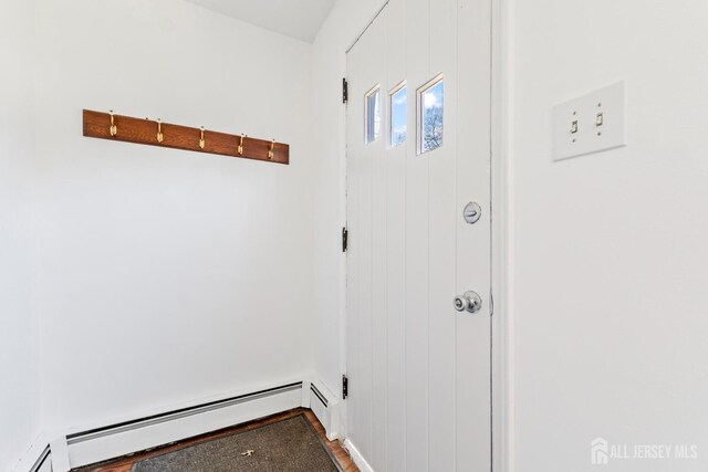 43 Jensen Ave, Fords, NJ 08863 - entryway with a baseboard radiator and wood finished floors