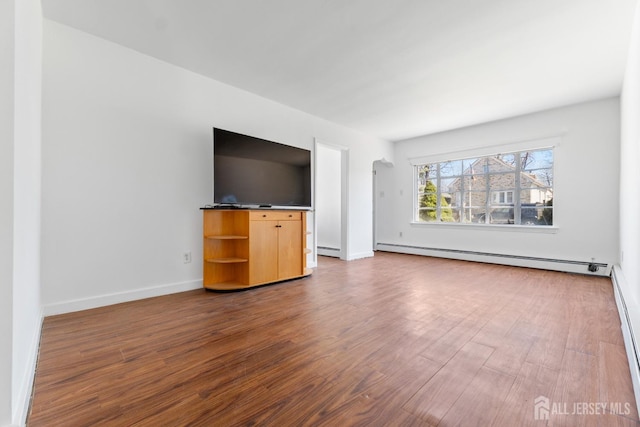 43 Jensen Ave, Fords, NJ 08863 - unfurnished living room with baseboards, baseboard heating, and dark wood-type flooring