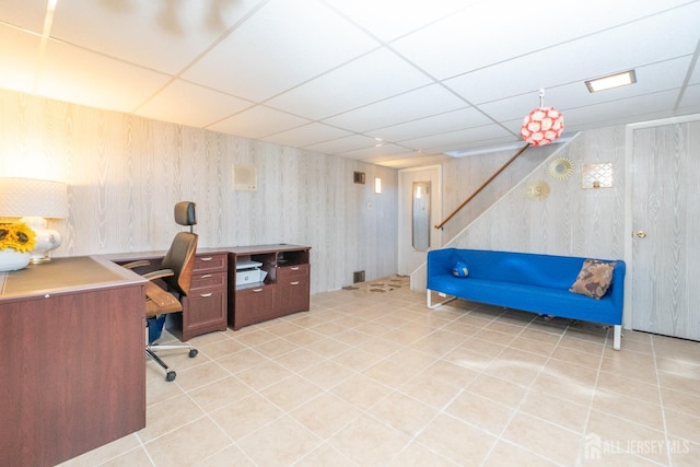 office with light tile patterned floors and a drop ceiling