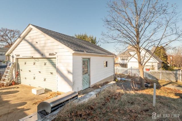 garage featuring fence