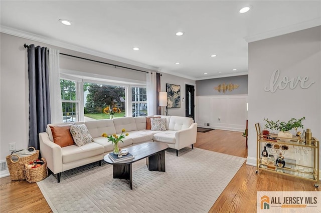 27 Collins Rd, Hamilton, NJ 08619 - living room featuring ornamental molding, wood finished floors, recessed lighting, a wainscoted wall, and a decorative wall