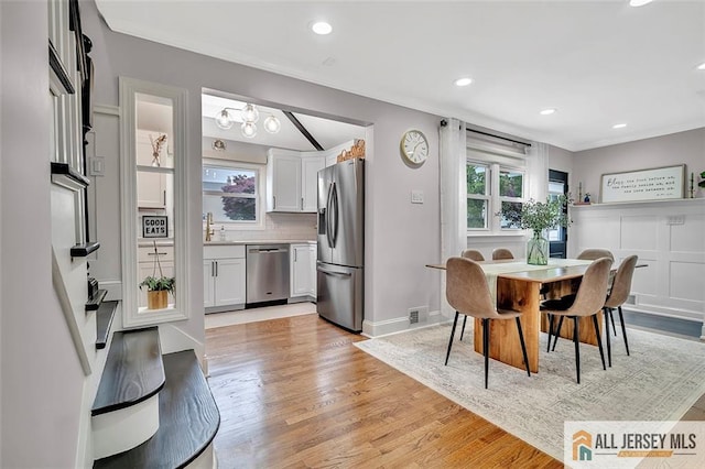 27 Collins Rd, Hamilton, NJ 08619 - dining area featuring light wood-style floors, recessed lighting, baseboards, a chandelier, and crown molding