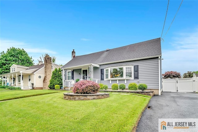27 Collins Rd, Hamilton, NJ 08619 - view of front facade with a gate, covered porch, and a chimney