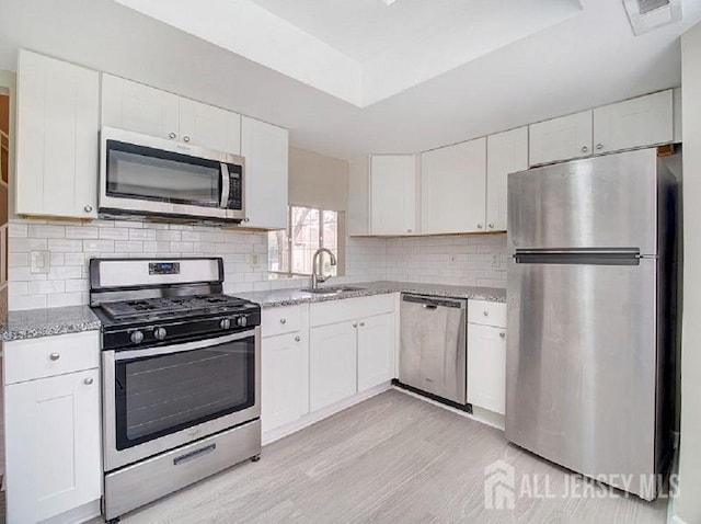308 Pewter Ct, Old Bridge, NJ 08857 - kitchen featuring stainless steel appliances, white cabinets, and light stone counters