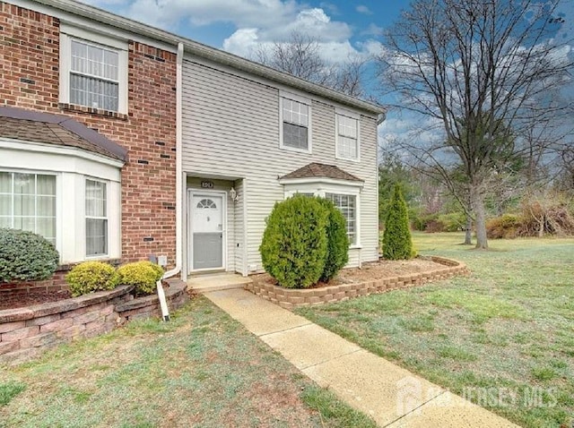 308 Pewter Ct, Old Bridge, NJ 08857 - view of front of home featuring a front yard and brick siding