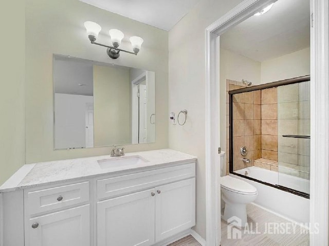 308 Pewter Ct, Old Bridge, NJ 08857 - bathroom with toilet, vanity, and enclosed tub / shower combo