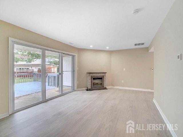 308 Pewter Ct, Old Bridge, NJ 08857 - unfurnished living room with light wood-style floors, baseboards, a fireplace, and recessed lighting