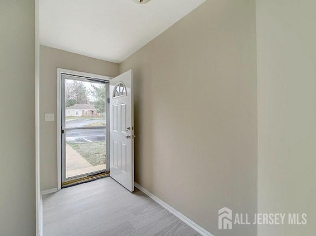 308 Pewter Ct, Old Bridge, NJ 08857 - entryway with baseboards and light wood-style flooring