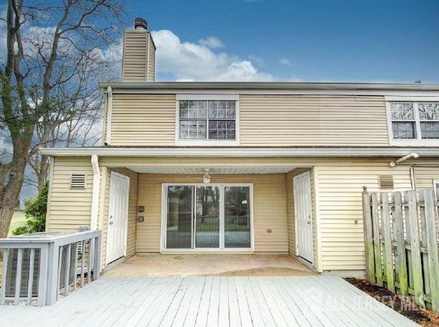308 Pewter Ct, Old Bridge, NJ 08857 - rear view of property featuring fence, a deck, and a chimney