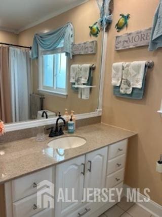 bathroom featuring tile patterned floors and vanity