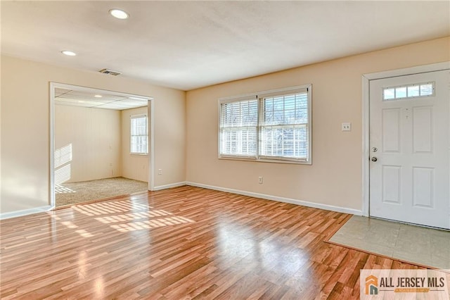 entrance foyer with baseboards, visible vents, wood finished floors, and recessed lighting