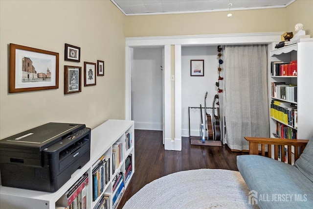 sitting room featuring wood finished floors and baseboards