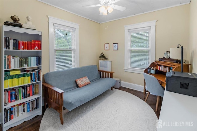 office with plenty of natural light, wood finished floors, ceiling fan, and baseboards