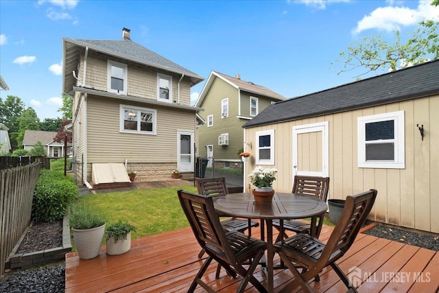 328 Becker St, Highland Park, NJ 08904 - wooden deck with outdoor dining area and an outbuilding