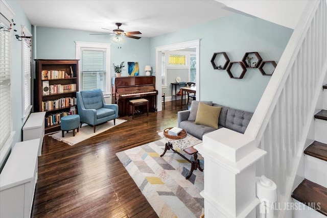 living area with wood finished floors, plenty of natural light, and ceiling fan