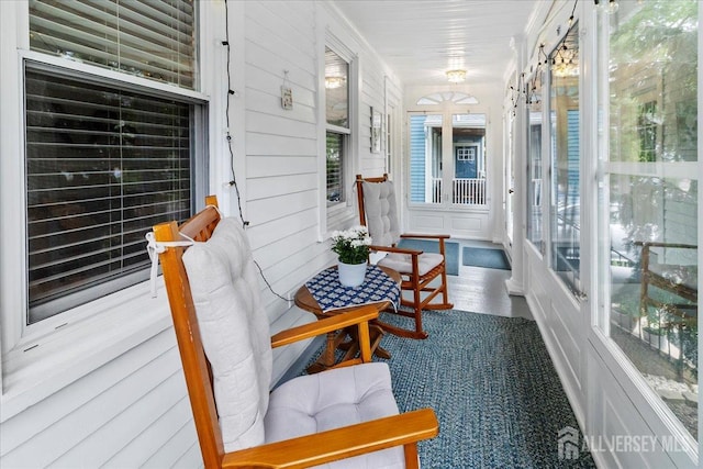 sunroom featuring healthy amount of natural light
