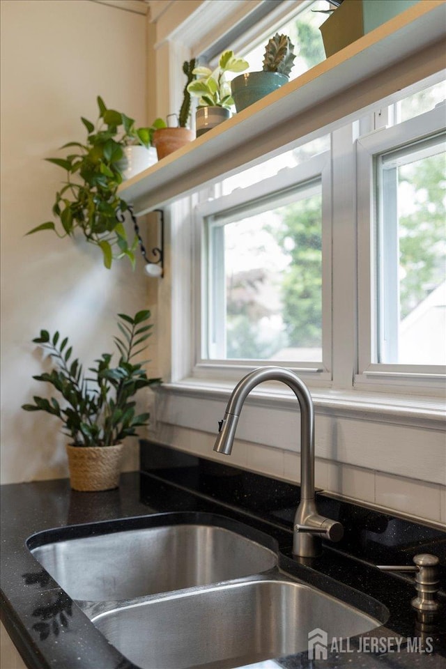kitchen view of a sink and backsplash