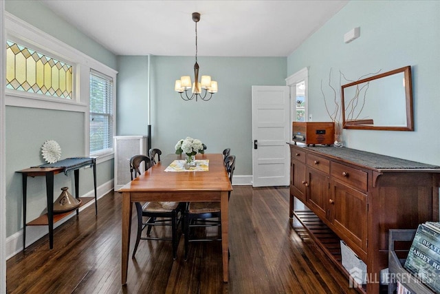 328 Becker St, Highland Park, NJ 08904 - dining room featuring dark wood-type flooring, a chandelier, and plenty of natural light