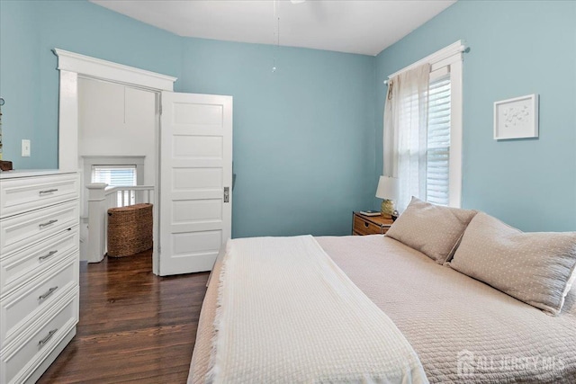 bedroom featuring dark wood-style floors