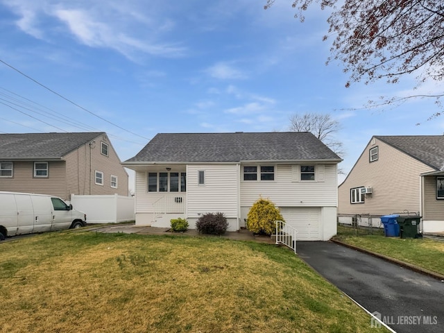 149 Jefferson St, Menlo Park Terrace, NJ 08840 - back of house with asphalt driveway, an attached garage, and roof with shingles