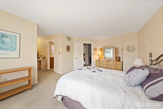 bedroom featuring light colored carpet, baseboards, and visible vents