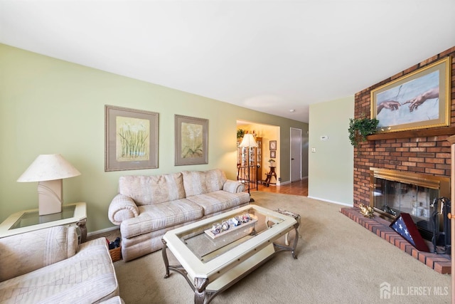 carpeted living area with a fireplace and baseboards