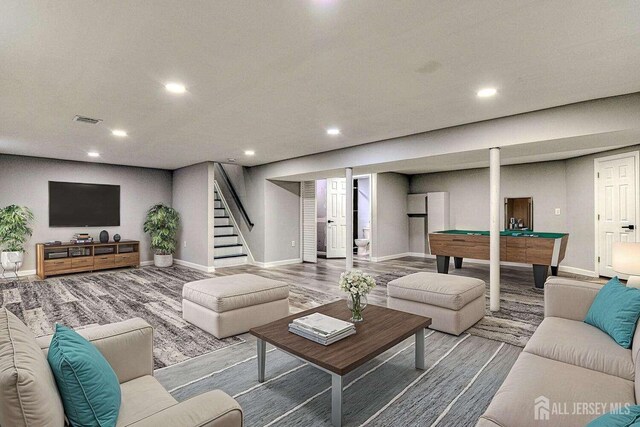 living room featuring hardwood / wood-style flooring and billiards