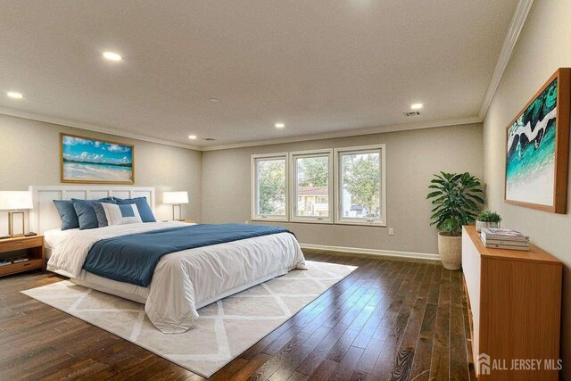 bedroom with ornamental molding and dark wood-type flooring