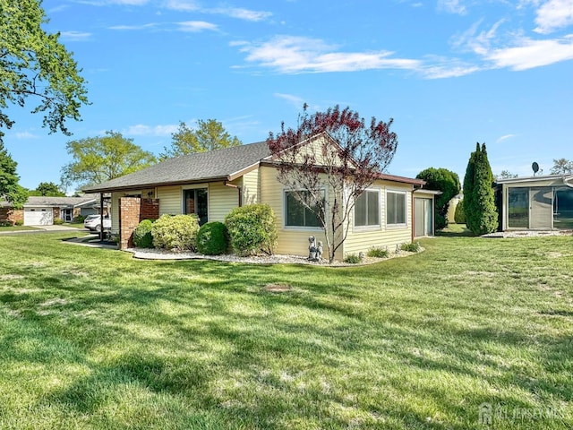 view of side of home with a lawn