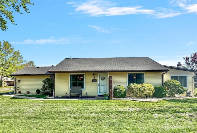 ranch-style home with a front yard