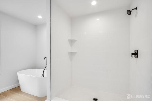 709 Plainfield Ave, Piscataway, NJ 08854 - full bathroom featuring tiled shower, recessed lighting, a freestanding bath, and wood finished floors