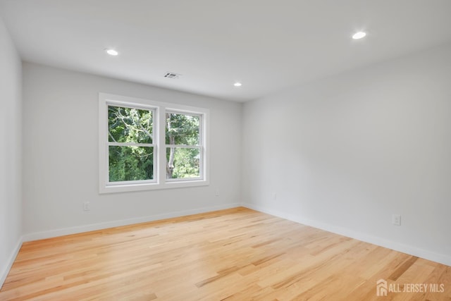 709 Plainfield Ave, Piscataway, NJ 08854 - spare room with wood finished floors and recessed lighting