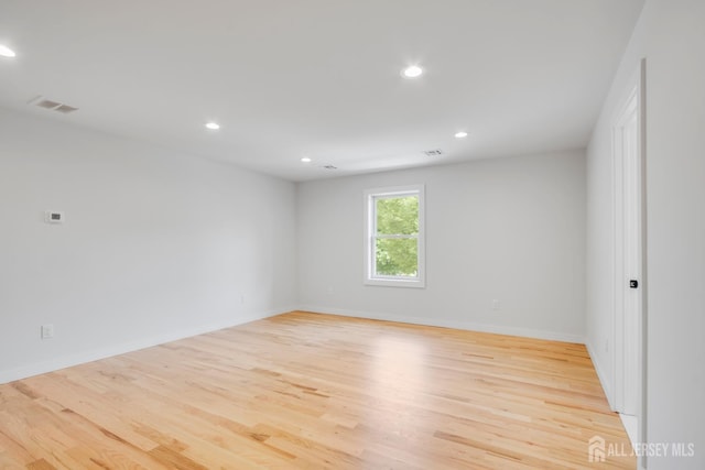 709 Plainfield Ave, Piscataway, NJ 08854 - unfurnished room featuring wood finished floors and recessed lighting