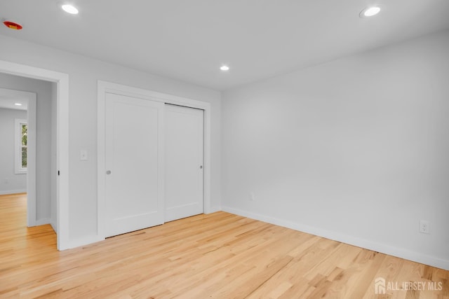 709 Plainfield Ave, Piscataway, NJ 08854 - unfurnished bedroom with light wood-type flooring, recessed lighting, and a closet