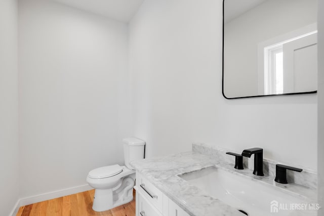 709 Plainfield Ave, Piscataway, NJ 08854 - half bathroom featuring vanity and wood finished floors