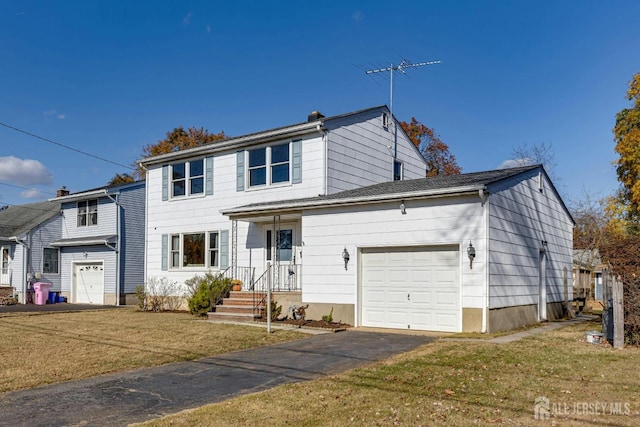 view of front facade featuring a garage and a front yard