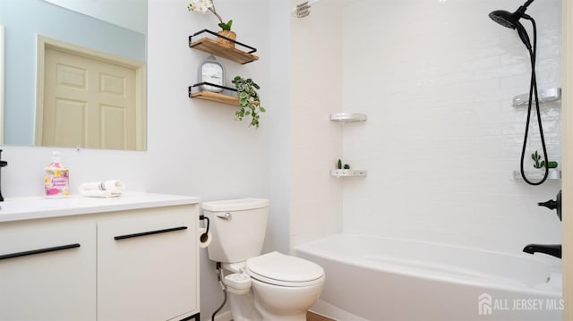 bathroom featuring bathtub / shower combination, vanity, and toilet