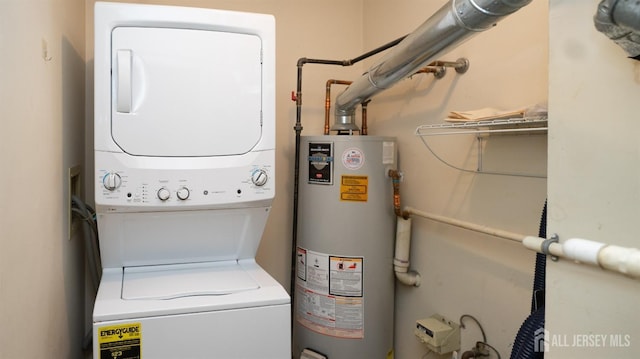 laundry area with stacked washer / dryer, laundry area, and gas water heater