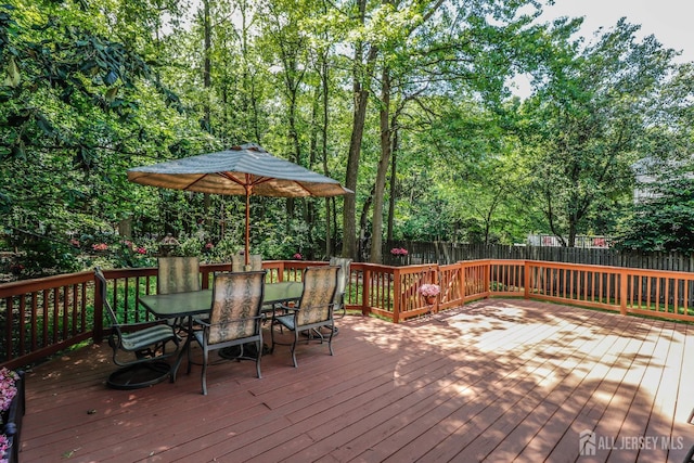 89 King St, Edison, NJ 08820 - wooden deck featuring outdoor dining space and a fenced backyard
